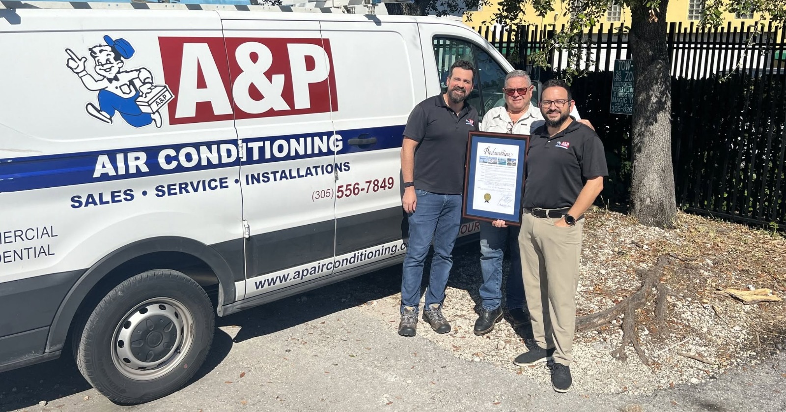 A&P Air Conditioning team receiving a local proclamation